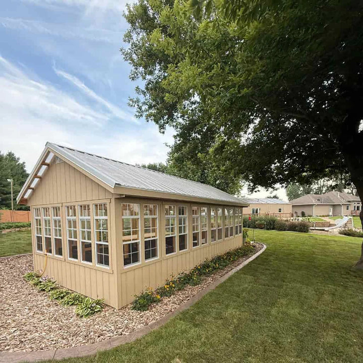 12X24 EZ-fir wooden greenhouse with glass windows in a garden setting

Details 