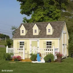 8x10 Cape Cod Playhouse in a real backyard lifestyle with deck and rail