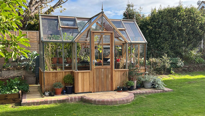 Cedar Alton Durham Greenhouse backyard view