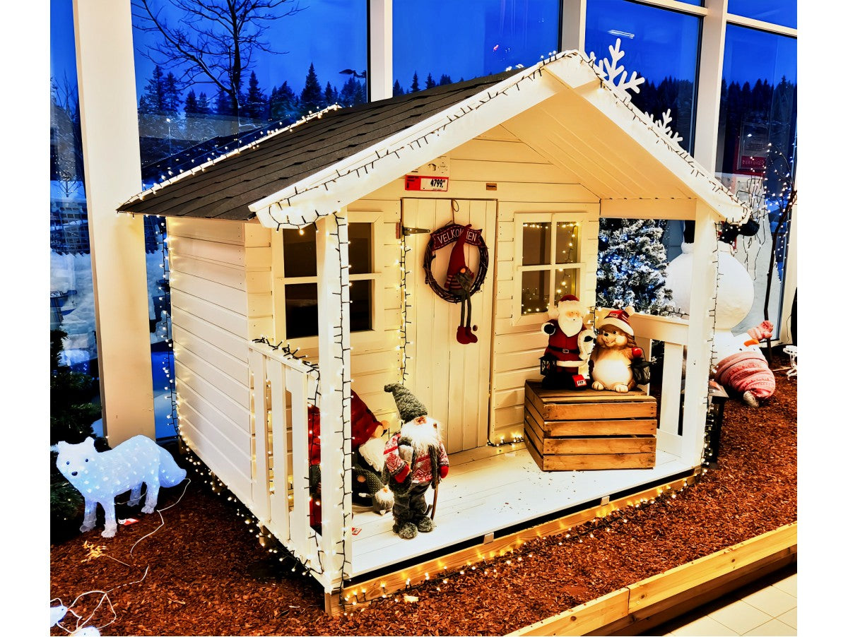 Felix playhouse installed on-site in natural wood finish