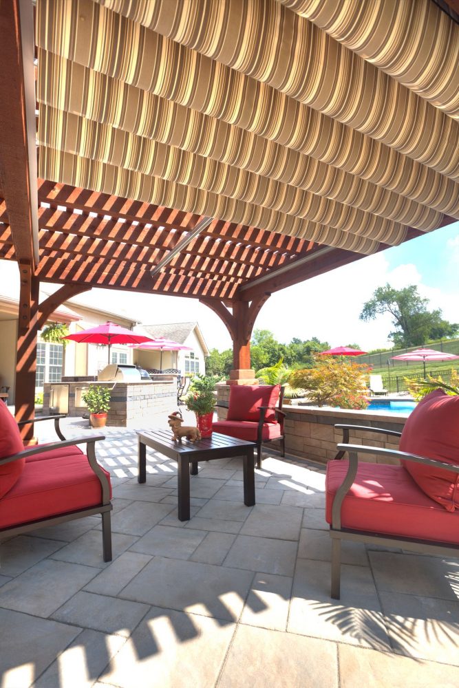 EZ shade canopy fully extended over large wooden pergola