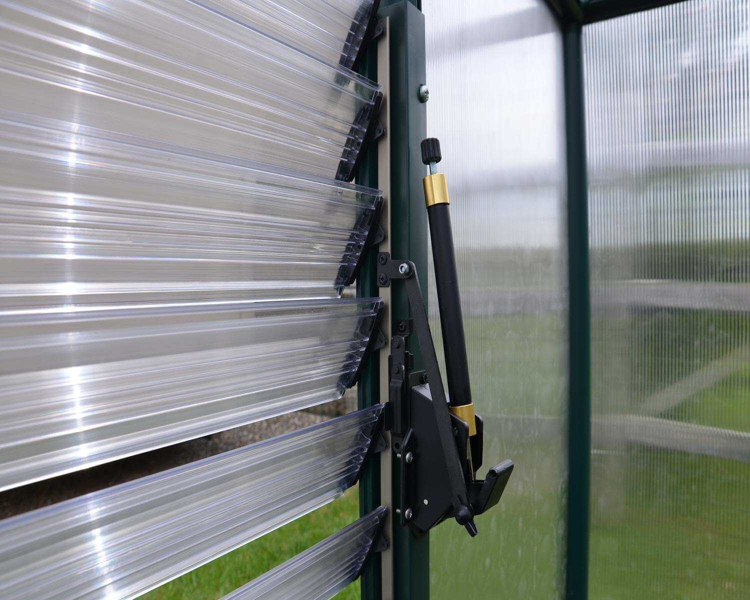 Palram Automatic Louver Window Opener installed on greenhouse
