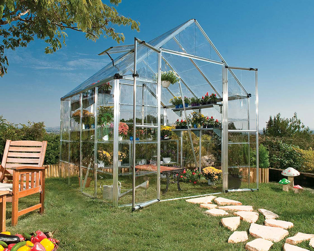 Snap & Grow 8ft greenhouse in a sunny garden setting, filled with plants