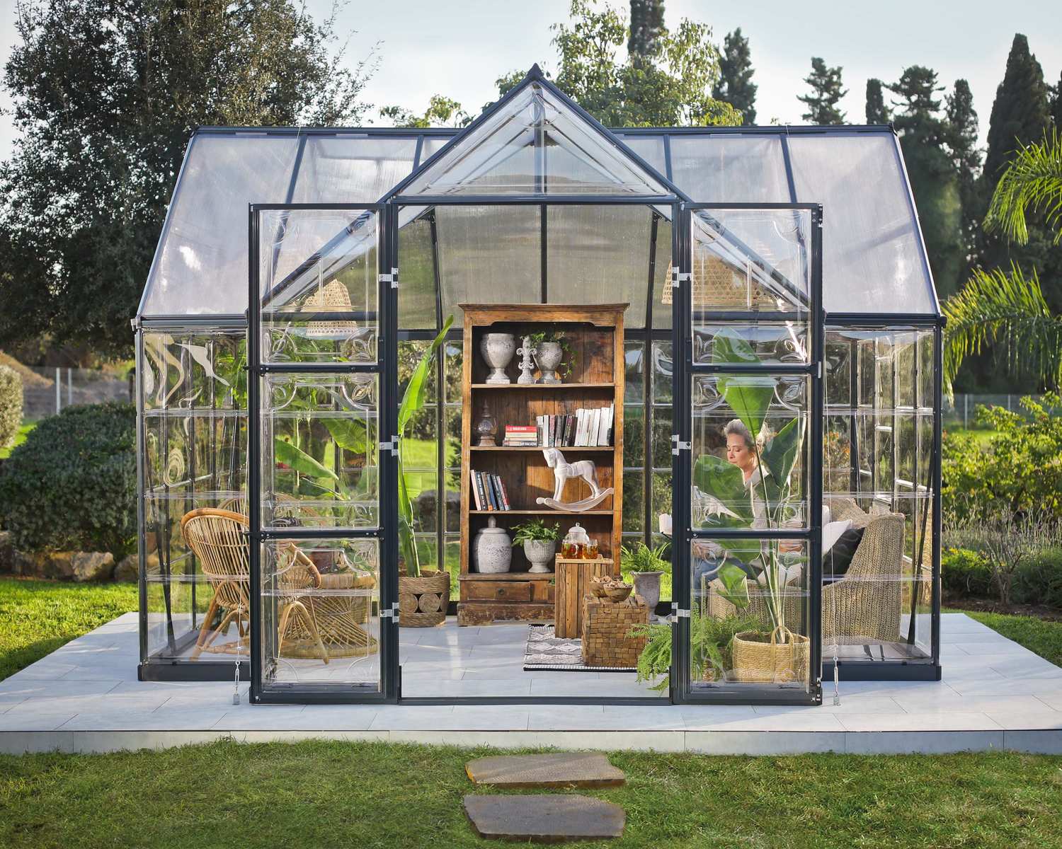 Victory Orangery greenhouse in a lush garden setting