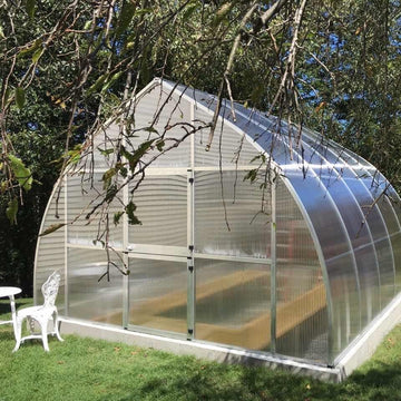 Riga XL greenhouse exterior view showing the arched onion-shaped roof design