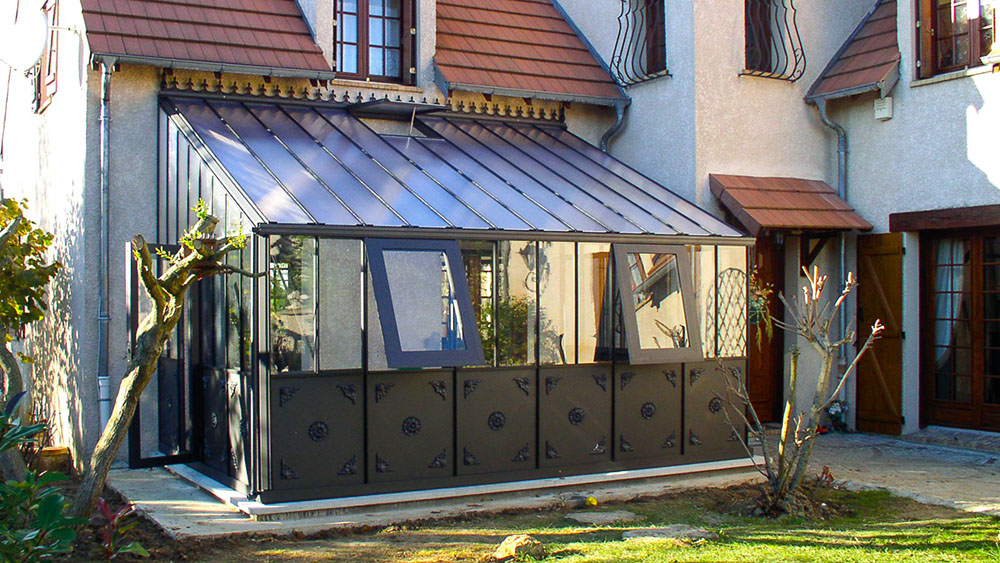 Arcadia Lean-To Greenhouse installed against home