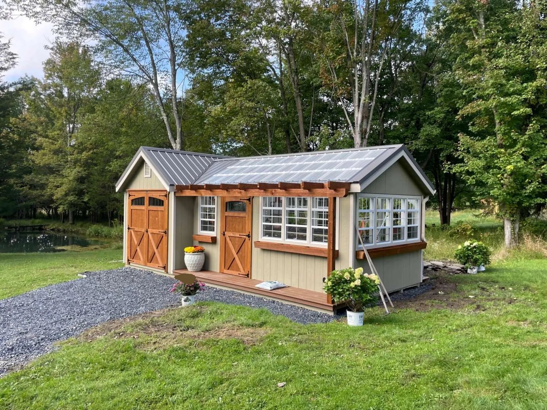 side view of cottage with greenhouse