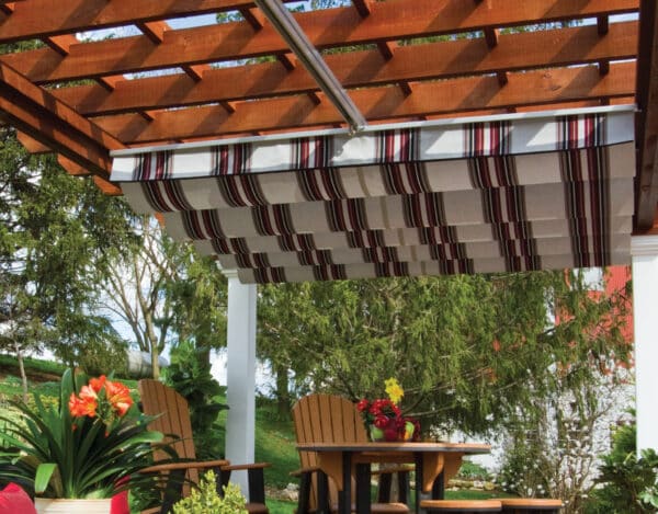 EZ shade canopy in a striped sunbrella fabric extended halfway using triple track system 