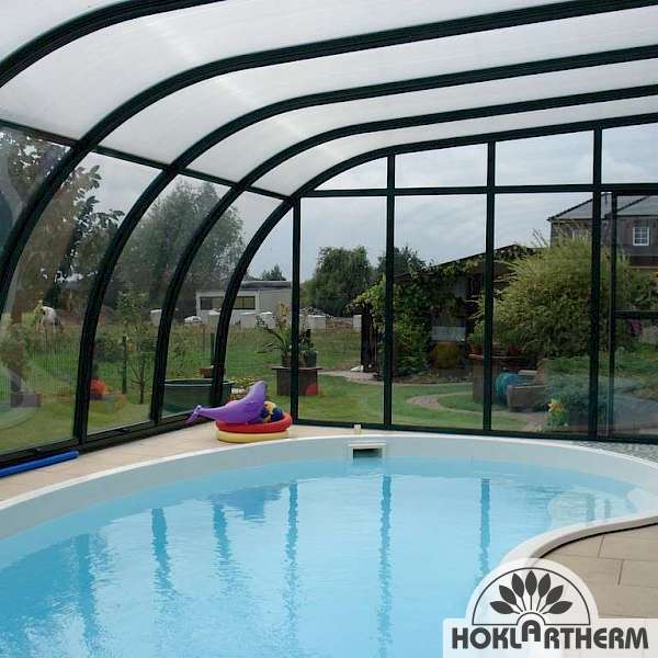 Pool enclosed with Berlin solarveranda by hoklartherms curved attached sunroom