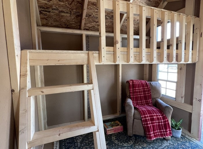 Interior view of The Hideaway Playhouse showing loft area