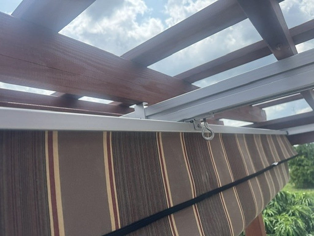 Installed canopy track and hook hardware under pergola beam, Sunbrella fabric striped pattern