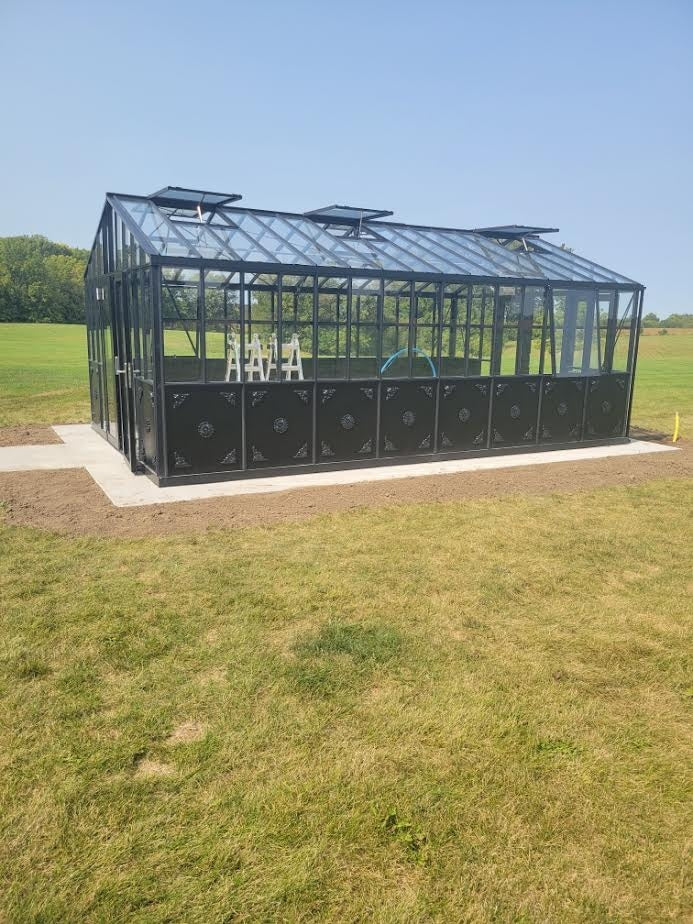 Real customer install of the Janssens Retro Royal Victorian Greenhouse — a complex configuration with doors centered on the gable end