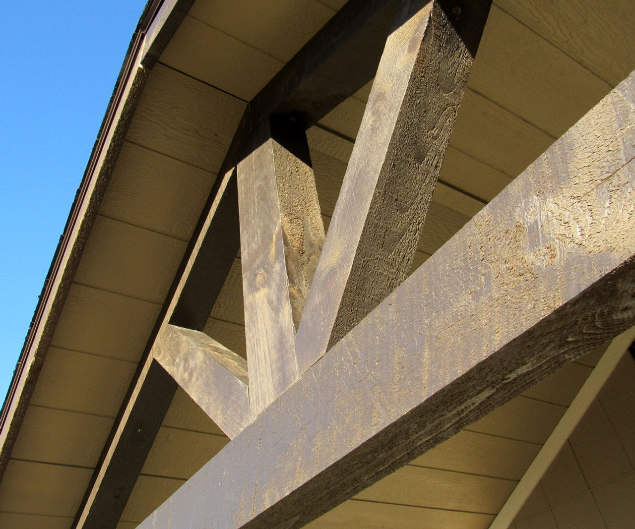 woodsman shed close up of the wooden beams of the covered deck 